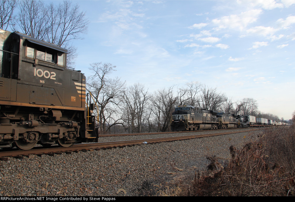 NS 4049 leads train 21J past NS 1002